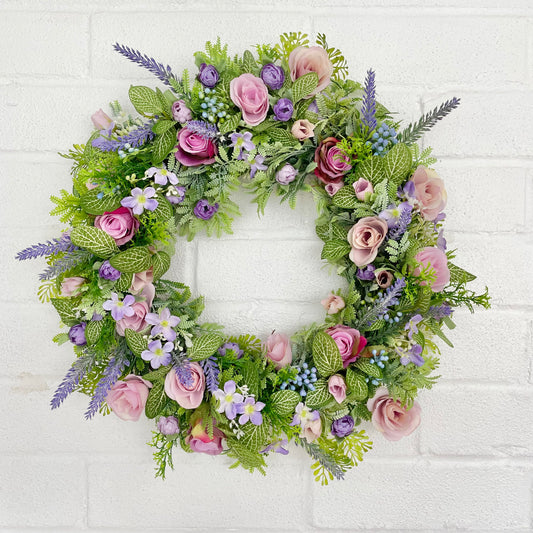 Purple artificial flower door wreath with roses, lavender and blossom