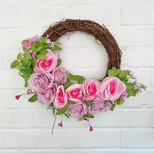 Artificial flower door wreath with pink roses