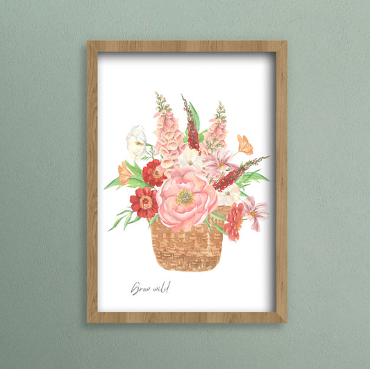 A gorgeous mix of pink, red and ivory countryside flowers in a wicker basket.