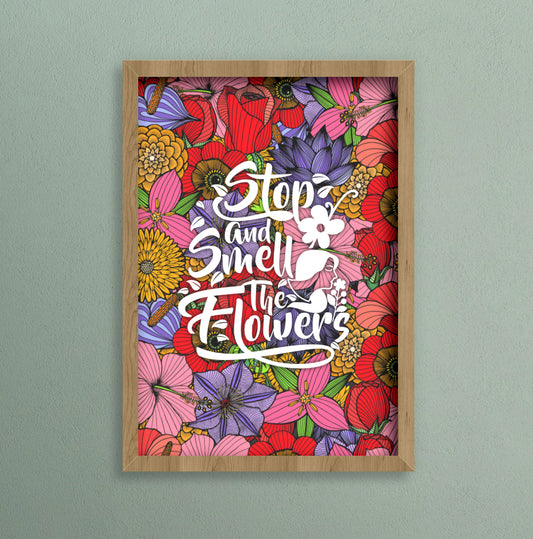 Colourful a4 print with a flower background and text that says stop and smell the flowers