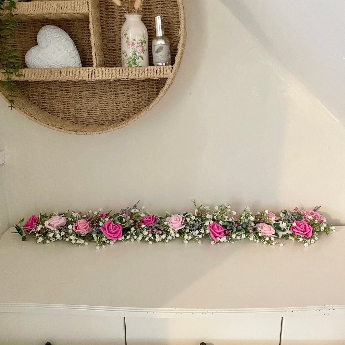 Pink flower garland of artificial roses